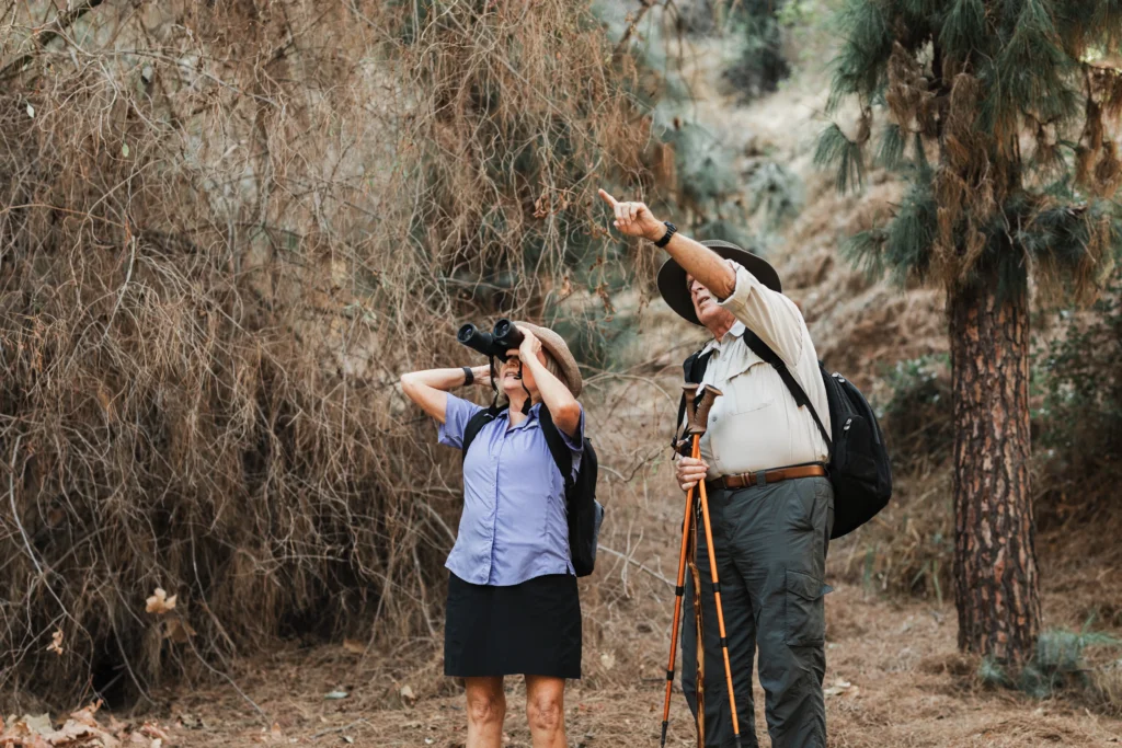 old couple enjoying bird watching