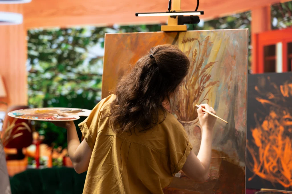 woman paining on her studio