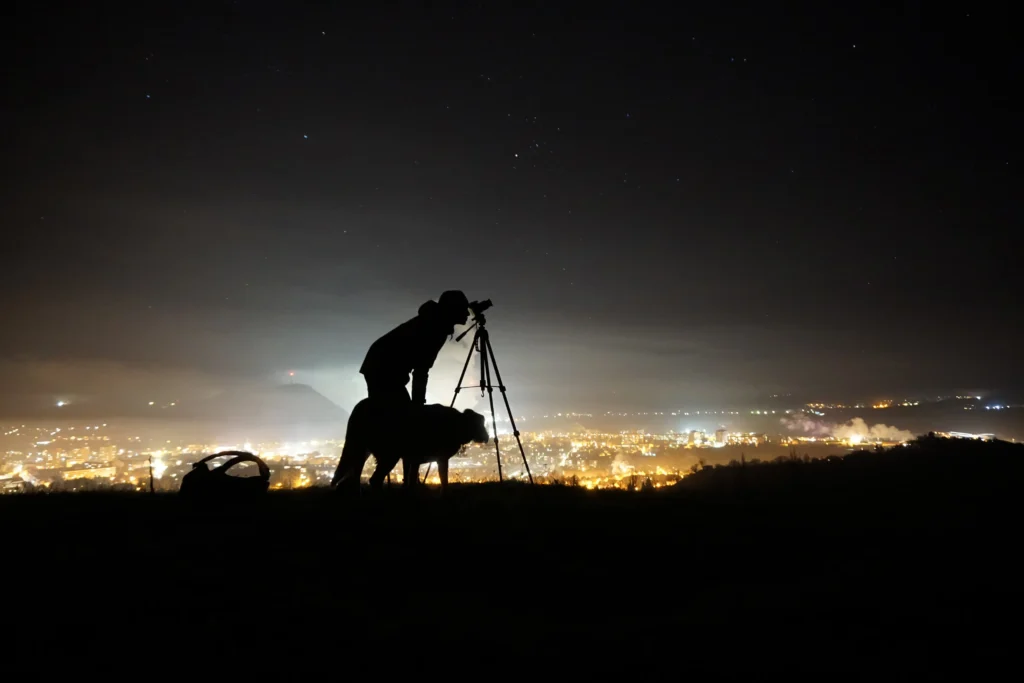 silhouette of a man and dog