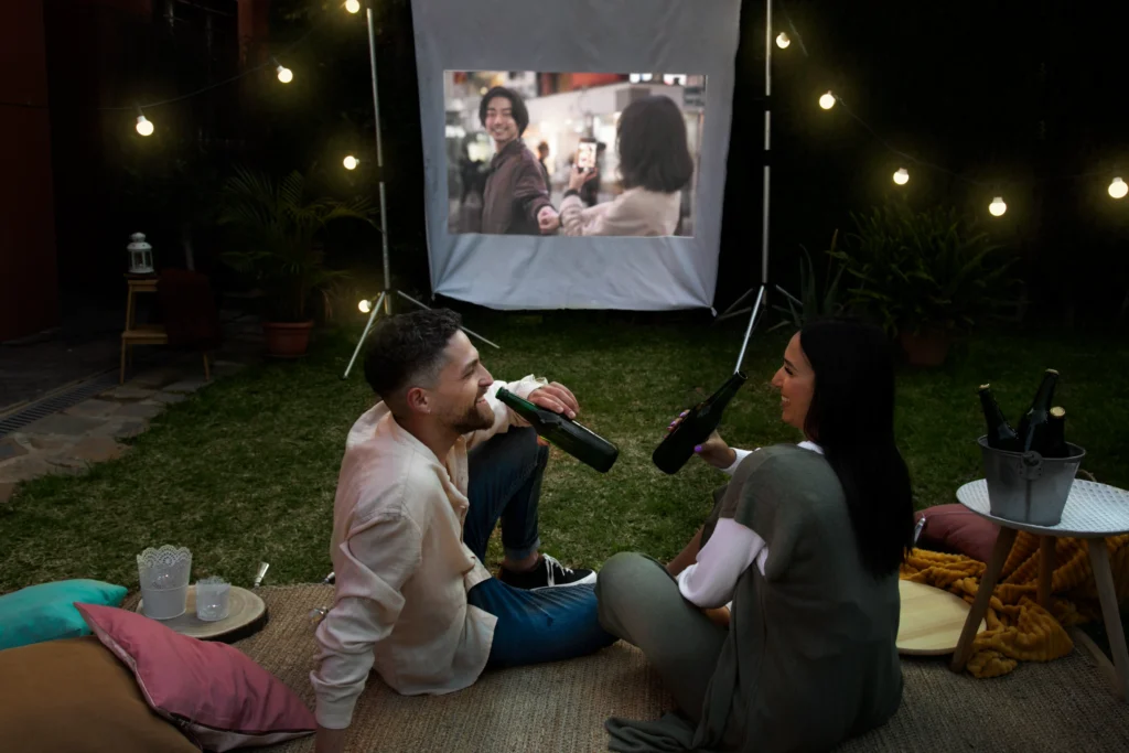 friends having fun with cinema in an open air