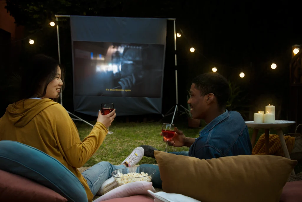 friends having fun with outdoor movie